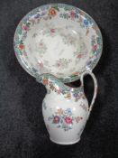 A Copeland Spode floral patterned wash jug and basin.