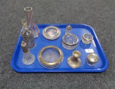 A box of various silver topped items