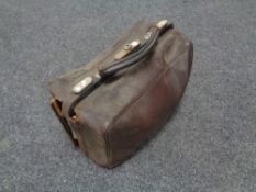 A vintage leather doctors bag