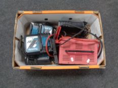 A box containing a Street Wise battery charger together with four Makita battery chargers.