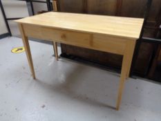 A contemporary pine office table fitted with a drawer