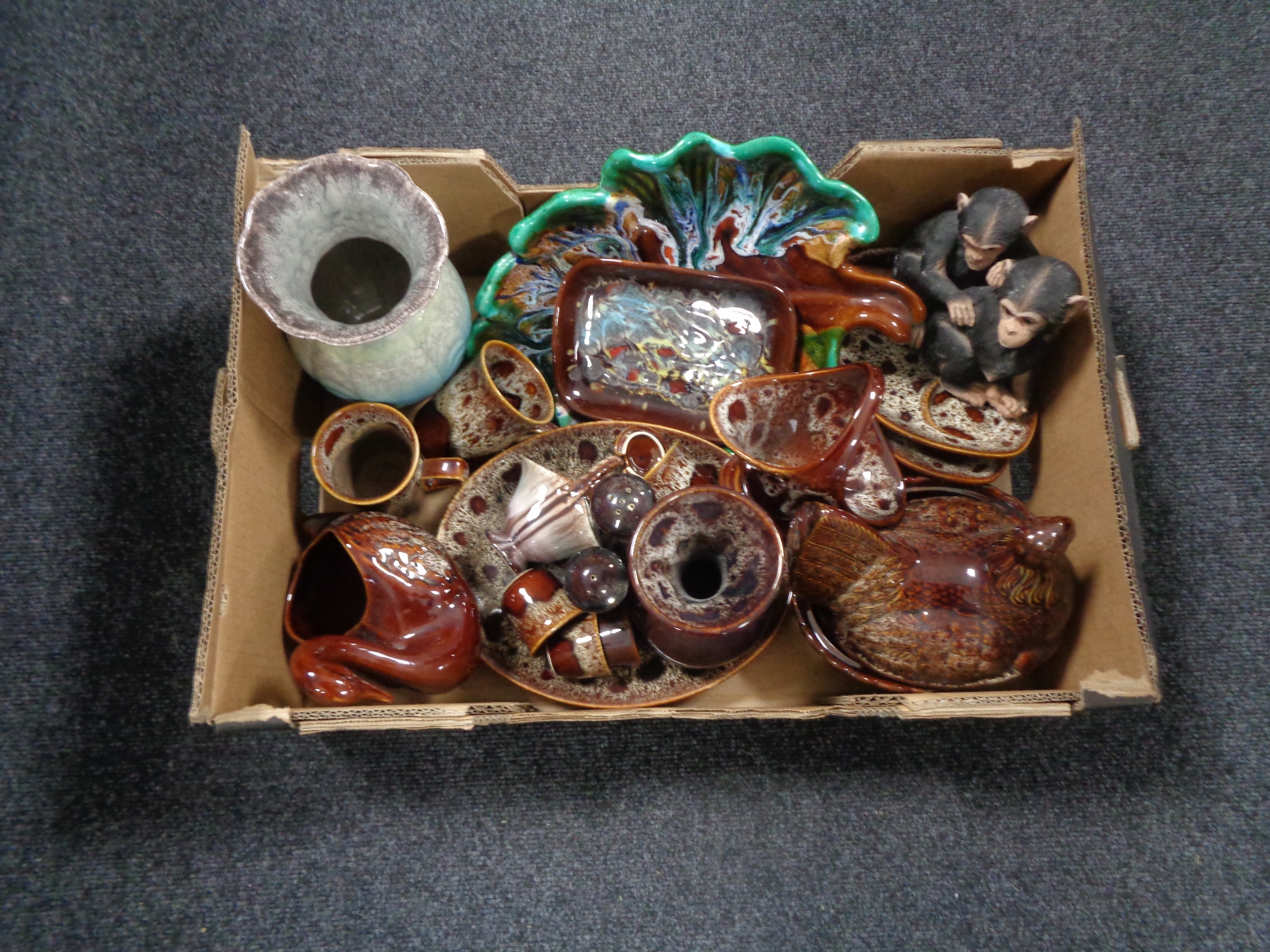 A box containing assorted Studio pottery.