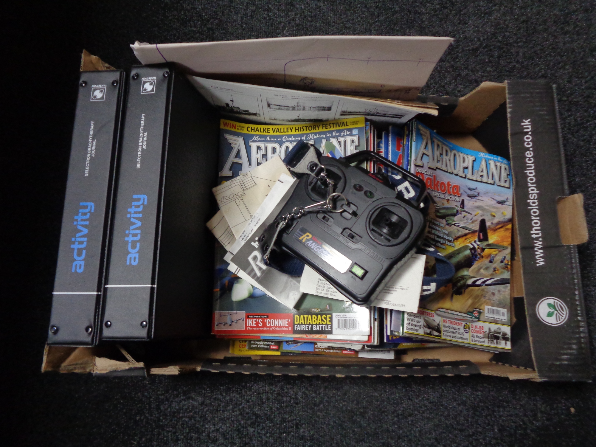 A box containing aeroplane magazines,