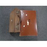 Two vintage leather luggage cases together with a folder of 78's,