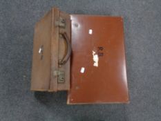 Two vintage leather luggage cases together with a folder of 78's,