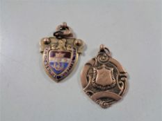 A 9ct gold 1926/27 Knight Memorial Cup medal and a further 9ct gold fob, 13.6g.