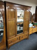 A 19th century inlaid mahogany mirror door wardrobe fitted two drawers beneath