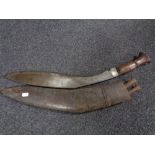 A very large Kurki knife in leather sheath