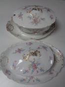 Two French floral patterned tureens on stands.