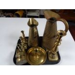 A tray of antique and later brass ware to include miniature coal helmet with tongs, candlesticks,
