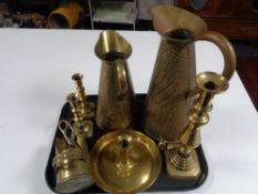 A tray of antique and later brass ware to include miniature coal helmet with tongs, candlesticks,