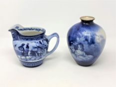 An antique Royal Doulton blue and white jug The Elginton Tournament and a Royal Doulton bulbous