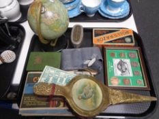 A tray containing miscellaneous to include a tin plate globe on stand, post office savings banks,