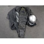 An MDS motorcycle helmet together with a set of motorcycle leathers and a waterproof suit