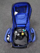 A gamer's bag containing Nintendo Gamecube with accessories