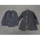 A vintage Blackburn police tunic with buttons and one other tunic