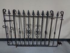 A pair of wrought iron gates each 120cm wide by 95cm high