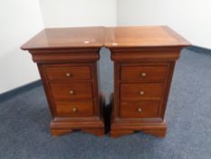 A good quality pair of three drawer chests in mahogany finish with brass handles