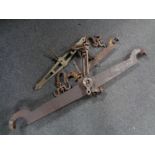 Three antique balance scale arms (two wrought iron,