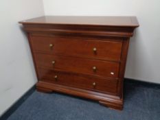 A good quality three drawer chest in mahogany finish with brass handles