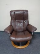 A Stressless brown leather adjustable armchair