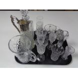 A tray containing assorted glassware to include whiskey decanter, claret jug, champagne glasses,