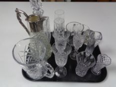 A tray containing assorted glassware to include whiskey decanter, claret jug, champagne glasses,