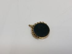 An antique gold swivel fob set with bloodstone