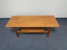 A teak two tier coffee table