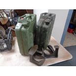Two 20l jerry cans together with two cobbler's lasts