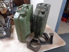 Two 20l jerry cans together with two cobbler's lasts