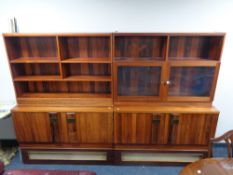 A mid century rosewood bookcase fitted with bookcase beneath