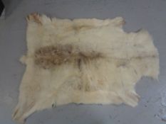 A reindeer skin rug