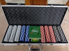 A set of poker chips in an aluminium case.