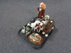 A tray of assorted figurines to include Japanese dogs, Beswick shire horse,