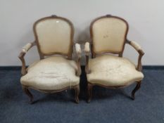 A pair of beech framed French salon armchairs