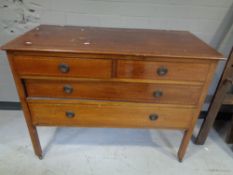 A late nineteenth century inlaid mahogany four drawer chest