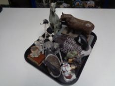 A tray containing composite figure of a bull on marble base together with assorted animal ornaments,
