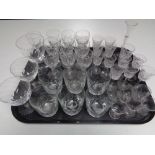 A tray containing early 20th century and later drinking glasses.