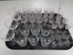 A tray containing early 20th century and later drinking glasses.
