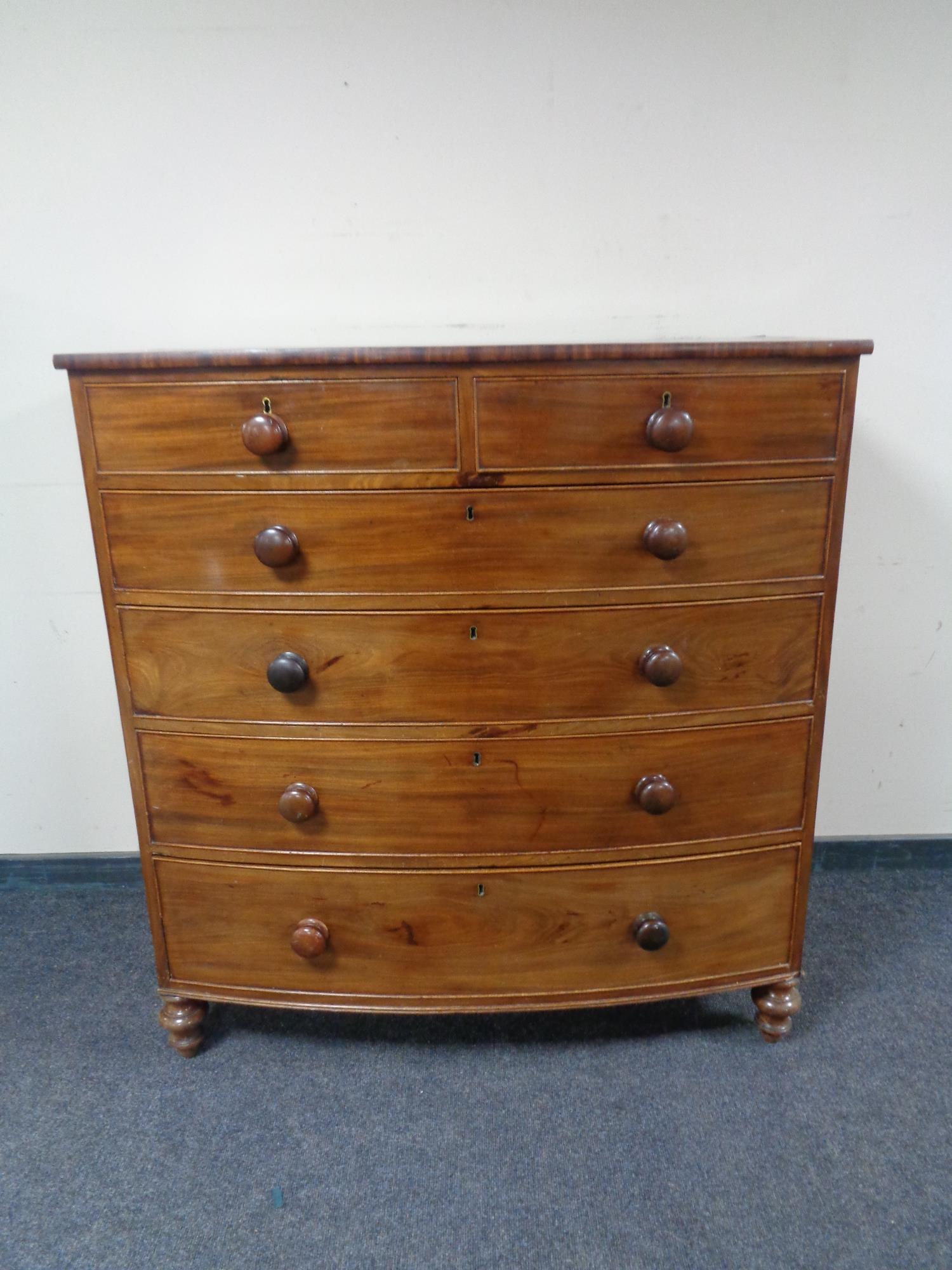 A Victorian mahogany bow fronted six drawer chest.