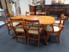 An oval inlaid yewwood twin pedestal dining table and six chairs CONDITION REPORT: