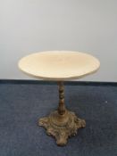 A circular wooden topped bar table on cast iron base, width 63 cm.