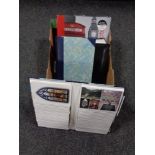 A box containing four postcard albums of 20th century and later postcards.