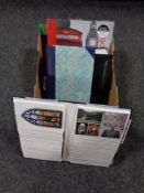 A box containing four postcard albums of 20th century and later postcards.