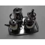 A four-piece Scotts of Stow stainless steel tea service on tray