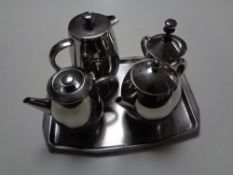 A four-piece Scotts of Stow stainless steel tea service on tray