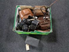 Two boxes of assorted vintage cameras to include a Zenit EM, boxed Brownie,