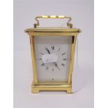 A French brass cased eight day carriage clock