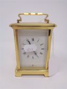 A French brass cased eight day carriage clock